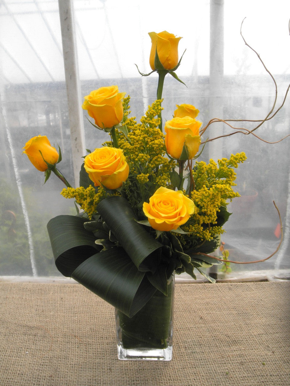 Kenton: Flower arrangement with yellow Roses and Solidago. Designed by Michler's Florist in Lexington, KY